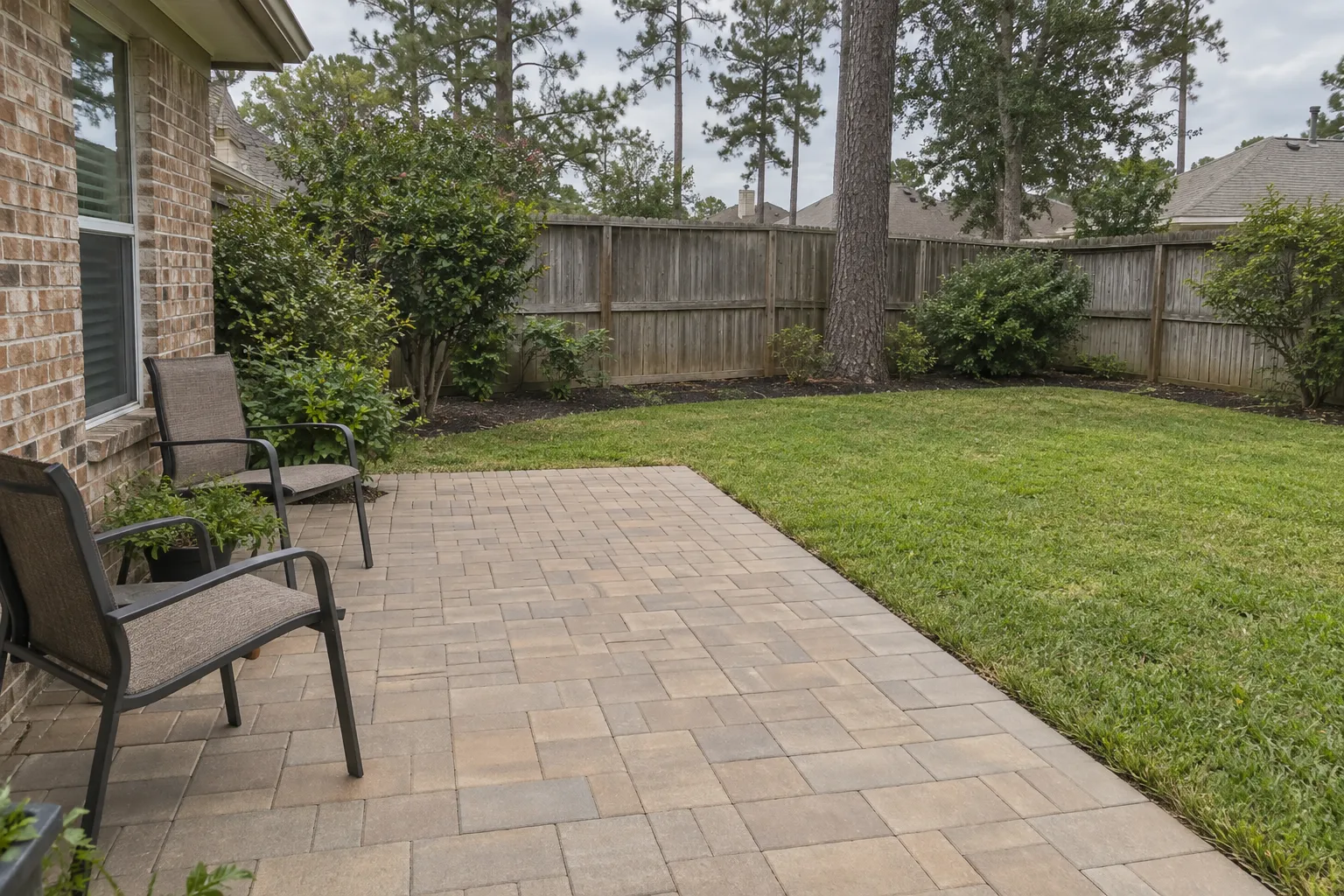 A residential patio built with individual concrete pavers